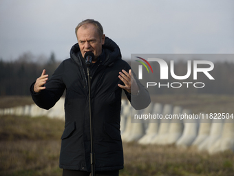 Polish Prime Minister Donald Tusk speaks to the media at the Polish-Russian border in Dabrowka, Poland, on November 30, 2024. The East Shiel...