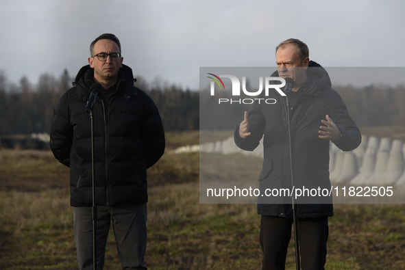 From left to right: Minister of Infrastructure Dariusz Klimczak and Prime Minister Donald Tusk participate in a press conference at the Poli...