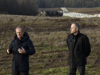 Polish Prime Minister Donald Tusk (left) and Deputy Minister of National Defense Cezary Tomczyk (right) take part in a press conference at t...