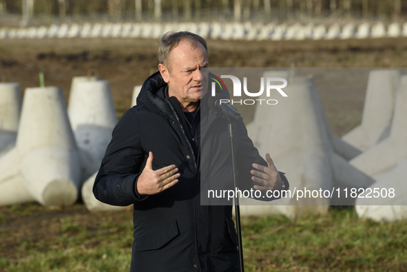 Polish Prime Minister Donald Tusk speaks to the media at the Polish-Russian border in Dabrowka, Poland, on November 30, 2024. The East Shiel...