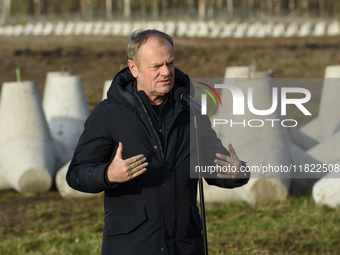 Polish Prime Minister Donald Tusk speaks to the media at the Polish-Russian border in Dabrowka, Poland, on November 30, 2024. The East Shiel...