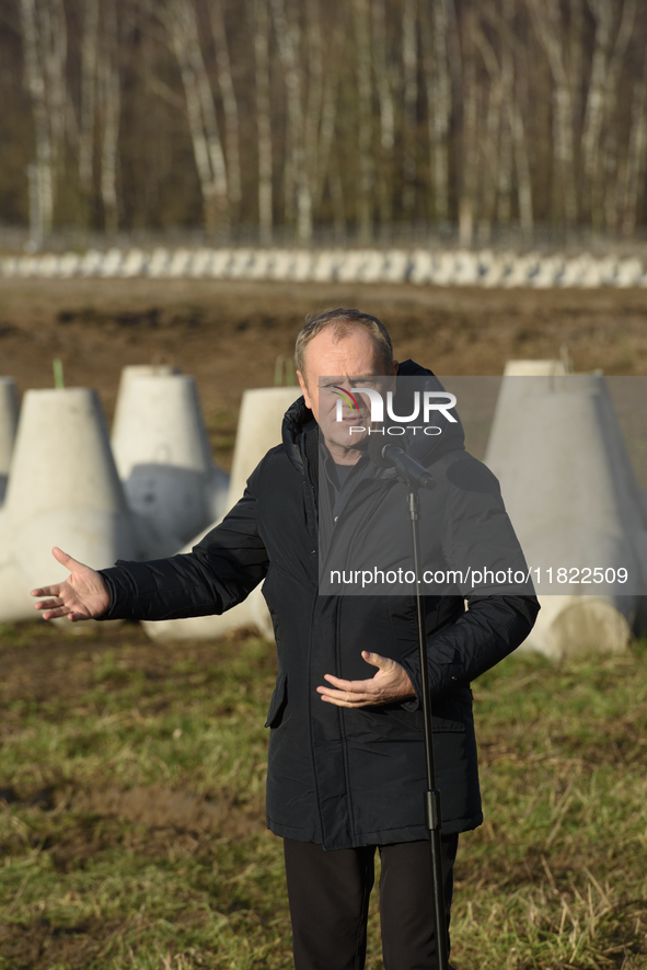 Polish Prime Minister Donald Tusk speaks to the media at the Polish-Russian border in Dabrowka, Poland, on November 30, 2024. The East Shiel...