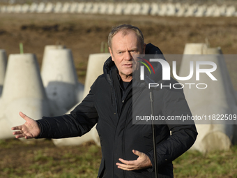 Polish Prime Minister Donald Tusk speaks to the media at the Polish-Russian border in Dabrowka, Poland, on November 30, 2024. The East Shiel...