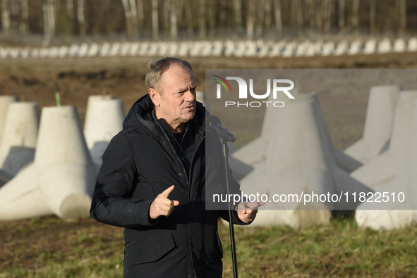 Polish Prime Minister Donald Tusk speaks to the media at the Polish-Russian border in Dabrowka, Poland, on November 30, 2024. The East Shiel...