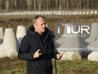 Polish Prime Minister Donald Tusk speaks to the media at the Polish-Russian border in Dabrowka, Poland, on November 30, 2024. The East Shiel...