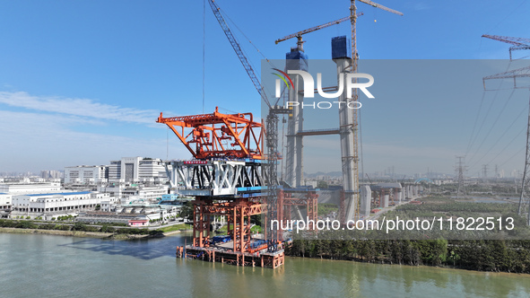 The Shenzhen-Jiangmen Railway Hongqili Waterway Public Railway Bridge construction takes place in Guangzhou, China, on November 30, 2024. 