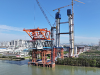 The Shenzhen-Jiangmen Railway Hongqili Waterway Public Railway Bridge construction takes place in Guangzhou, China, on November 30, 2024. (