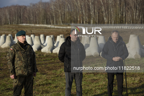 From left to right: Gen. Marek Wawrzyniak, Minister of Infrastructure Dariusz Klimczak, and Prime Minister Donald Tusk participate in a pres...