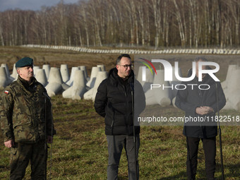 From left to right: Gen. Marek Wawrzyniak, Minister of Infrastructure Dariusz Klimczak, and Prime Minister Donald Tusk participate in a pres...