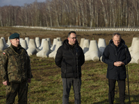 From left to right: Gen. Marek Wawrzyniak, Minister of Infrastructure Dariusz Klimczak, and Prime Minister Donald Tusk participate in a pres...