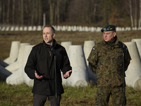 Deputy Minister of National Defense Cezary Tomczyk (left) and Col. Tomasz Sawczuk (right) take part in a press conference in Dabrowka, Polan...