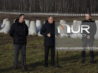 From left to right: Minister of Infrastructure Dariusz Klimczak, Prime Minister Donald Tusk, and Deputy Minister of National Defense Cezary...