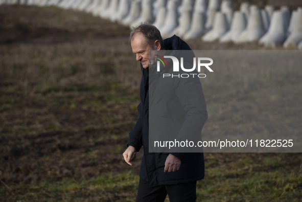 Polish Prime Minister Donald Tusk leaves a press conference held at the Polish-Russian border in Dabrowka, Poland, on November 30, 2024. The...