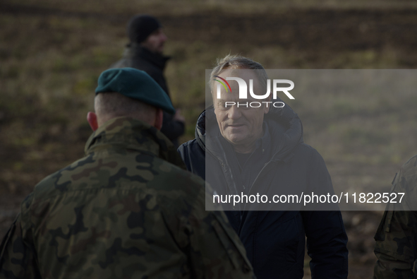 Polish Prime Minister Donald Tusk leaves a press conference held at the Polish-Russian border in Dabrowka, Poland, on November 30, 2024. The...