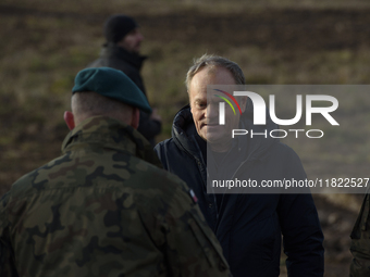 Polish Prime Minister Donald Tusk leaves a press conference held at the Polish-Russian border in Dabrowka, Poland, on November 30, 2024. The...