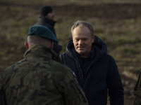 Polish Prime Minister Donald Tusk leaves a press conference held at the Polish-Russian border in Dabrowka, Poland, on November 30, 2024. The...