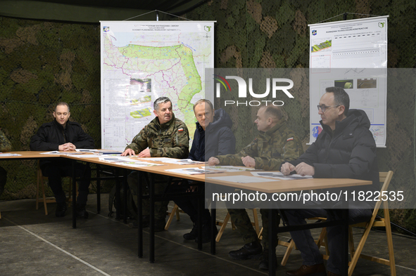 From left to right: Deputy Minister of National Defense Cezary Tomczyk, Gen. Marek Wawrzyniak, Prime Minister Donald Tusk, and Minister of I...