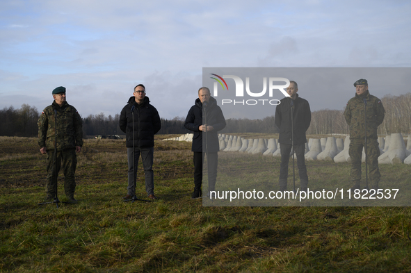 From left to right: Gen. Marek Wawrzyniak, Minister of Infrastructure Dariusz Klimczak, Prime Minister Donald Tusk, Deputy Minister of Natio...