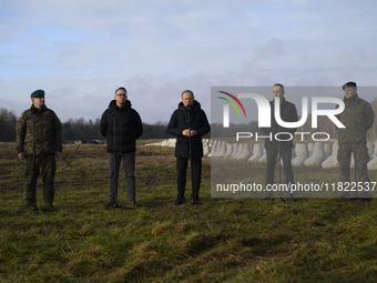 From left to right: Gen. Marek Wawrzyniak, Minister of Infrastructure Dariusz Klimczak, Prime Minister Donald Tusk, Deputy Minister of Natio...