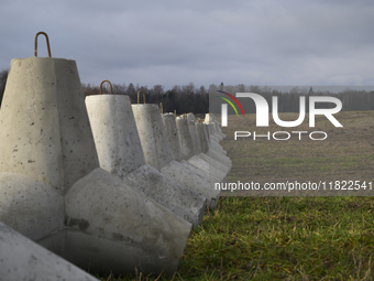 Anti-tank concrete fortifications are pictured at the Polish-Russian border in Dabrowka, Poland, on November 30, 2024. The East Shield progr...