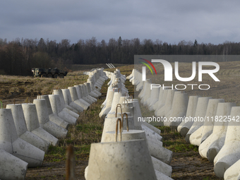 Anti-tank concrete fortifications are pictured at the Polish-Russian border in Dabrowka, Poland, on November 30, 2024. The East Shield progr...