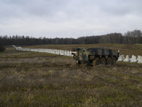 Anti-tank concrete fortifications are pictured at the Polish-Russian border as members of the Polish armed forces stand guard in Dabrowka, P...