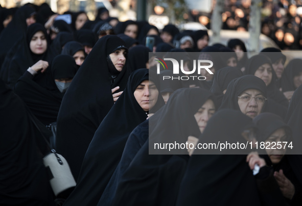 Veiled Iranian women participate in a funeral in northwestern Tehran, Iran, on November 30, 2024. 