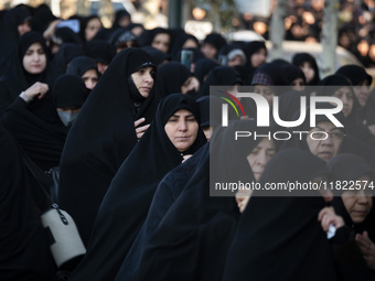 Veiled Iranian women participate in a funeral in northwestern Tehran, Iran, on November 30, 2024. (