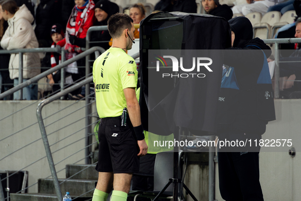 Referee Damian Kos checks the VAR screen during a game between KS Cracovia and Zaglebie Lubin in Krakow, Poland, on November 29, 2024. The m...