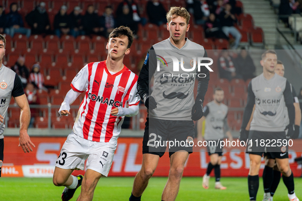 Fabian Bzdyl and Bartlomiej Kludka participate in the game between KS Cracovia and Zaglebie Lubin in Krakow, Poland, on November 29, 2024. T...