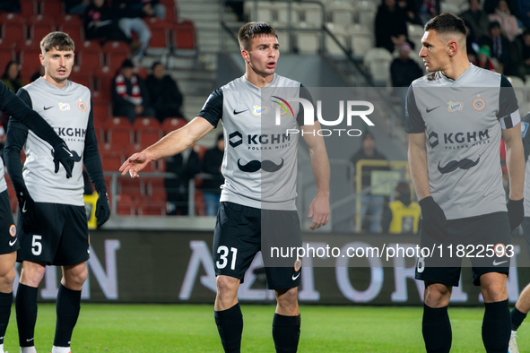 Igor Orlikowski and Damian Dabrowski participate in the game between KS Cracovia and Zaglebie Lubin in Krakow, Poland, on November 29, 2024....