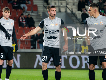 Igor Orlikowski and Damian Dabrowski participate in the game between KS Cracovia and Zaglebie Lubin in Krakow, Poland, on November 29, 2024....