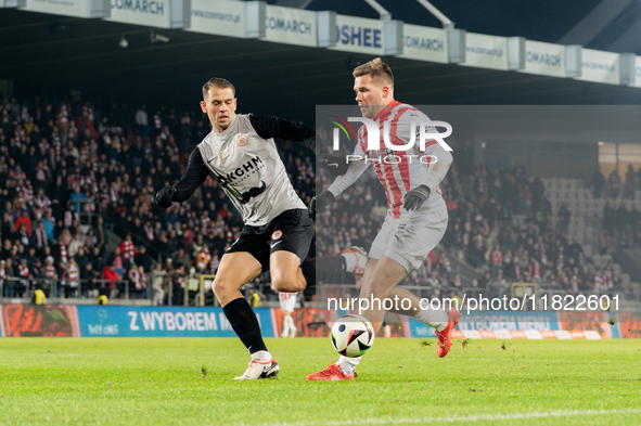 Bartosz Kopacz and Benjamin Kallman participate in the game between KS Cracovia and Zaglebie Lubin in Krakow, Poland, on November 29, 2024....