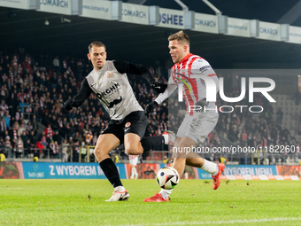 Bartosz Kopacz and Benjamin Kallman participate in the game between KS Cracovia and Zaglebie Lubin in Krakow, Poland, on November 29, 2024....