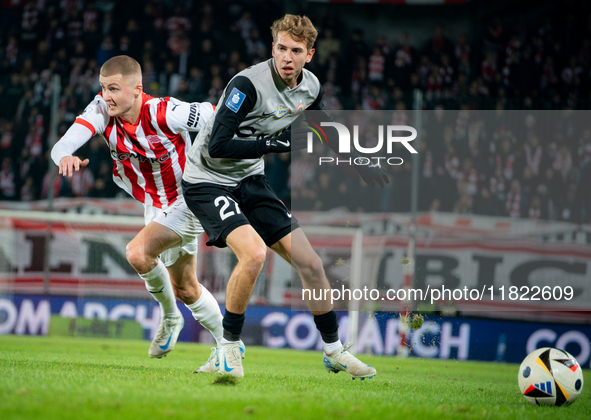 Bartlomiej Kludka and David Olafsson participate in the game between KS Cracovia and Zaglebie Lubin in Krakow, Poland, on November 29, 2024....