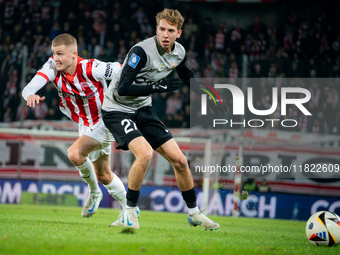 Bartlomiej Kludka and David Olafsson participate in the game between KS Cracovia and Zaglebie Lubin in Krakow, Poland, on November 29, 2024....