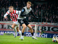 Bartlomiej Kludka and David Olafsson participate in the game between KS Cracovia and Zaglebie Lubin in Krakow, Poland, on November 29, 2024....