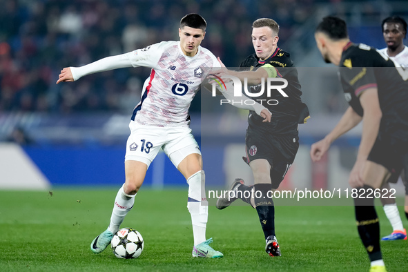 Matias Fernandez-Pardo of LOSC Lille and Lewis Ferguson of Bologna FC compete for the ball during the UEFA Champions League 2024/25 League P...