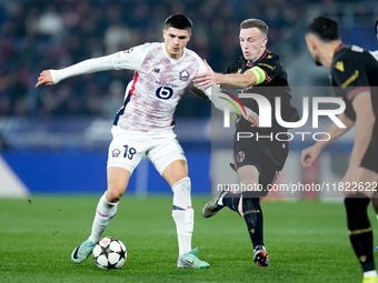 Matias Fernandez-Pardo of LOSC Lille and Lewis Ferguson of Bologna FC compete for the ball during the UEFA Champions League 2024/25 League P...