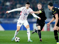 Matias Fernandez-Pardo of LOSC Lille and Lewis Ferguson of Bologna FC compete for the ball during the UEFA Champions League 2024/25 League P...