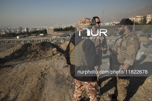 Armed IRGC special force military personnel stand together during a funeral for General Kioumars Pourhashemi, a commander of the Islamic Rev...