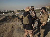 Armed IRGC special force military personnel stand together during a funeral for General Kioumars Pourhashemi, a commander of the Islamic Rev...