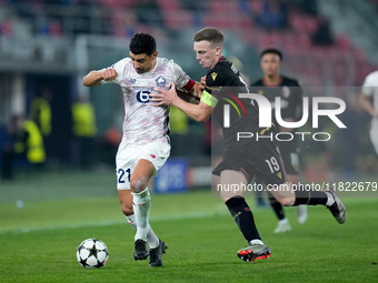 Benjamin Andre' of LOSC Lille and Lewis Ferguson of Bologna FC compete for the ball during the UEFA Champions League 2024/25 League Phase MD...