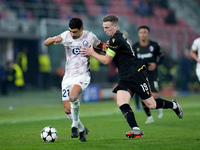 Benjamin Andre' of LOSC Lille and Lewis Ferguson of Bologna FC compete for the ball during the UEFA Champions League 2024/25 League Phase MD...