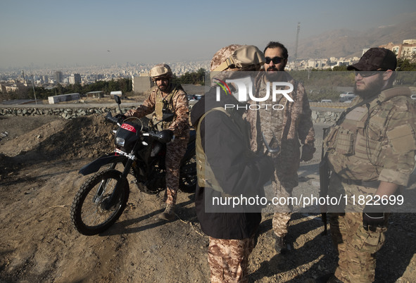 Armed IRGC special force military personnel stand together during a funeral for General Kioumars Pourhashemi, a commander of the Islamic Rev...