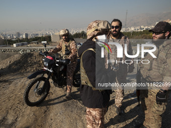 Armed IRGC special force military personnel stand together during a funeral for General Kioumars Pourhashemi, a commander of the Islamic Rev...