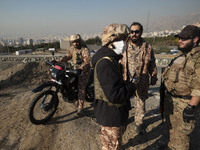 Armed IRGC special force military personnel stand together during a funeral for General Kioumars Pourhashemi, a commander of the Islamic Rev...