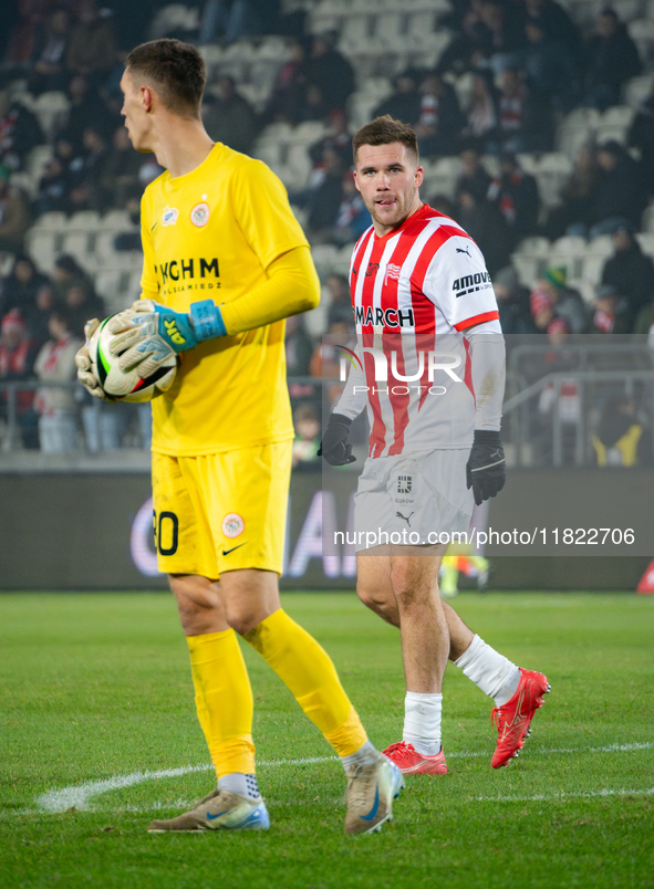 Benjamin Kallman and Zaglebie goalkeeper Dominik Hladun participate in the game between KS Cracovia and Zaglebie Lubin in Krakow, Poland, on...