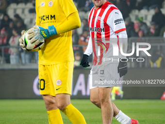 Benjamin Kallman and Zaglebie goalkeeper Dominik Hladun participate in the game between KS Cracovia and Zaglebie Lubin in Krakow, Poland, on...