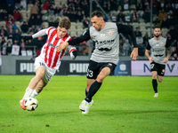 Filip Rozga and Jaroslaw Jach participate in the game between KS Cracovia and Zaglebie Lubin in Krakow, Poland, on November 29, 2024. This i...